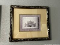 Framed architectural drawing with a central dome and decorative border in frame