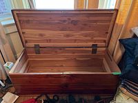 Open chest showing full interior cedar lining and lid support braces