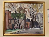 Front view of framed oil painting showing street scene with brick houses, trees, figures and car