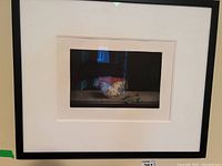 Overall view of framed mezzotint print showing bowl, cloth and flowers.