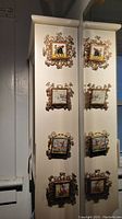 Set of four vintage Portuguese decorative copper framed painted tiles attached to a surface.