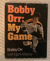Front cover of the book showing title and hockey player Bobby Orr in Boston Bruins uniform.