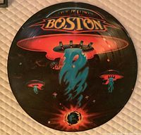 Front view of the framed Boston special limited edition picture disc featuring colorful UFO artwork.