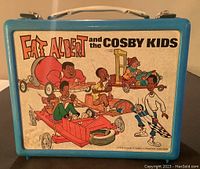 Front view of the lunch pail showing Fat Albert and the Cosby Kids cartoon characters on the front panel.