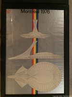 Framed Montreal 1976 Olympics poster showing three architectural designs over a gray background with a vertical rainbow stripe.