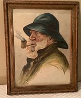 Frontal view of painting showing profile of old man with dark hat and smoking pipe, with visible scrape damage on bottom left corner and textured brush strokes.