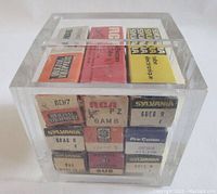 Front view of two layers of fuse boxes inside clear acrylic display cube.