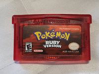 Front view of the Pokemon Ruby Version Game Boy Advance cartridge showing the label and red translucent plastic.