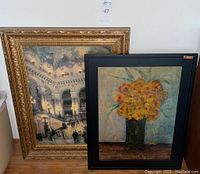 Two framed art pieces side by side showing the floral painting and the opera house reproduction