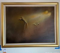 Front view of framed textured raised abstract painting