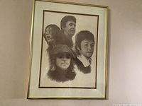 Full view of the framed Beatles portrait print showing all four band members in detailed black and white.