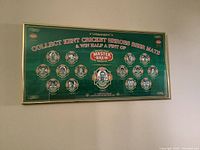 Full view of the framed print showing the overall layout and design of the beer mats portraying cricket heroes.