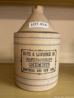 Full view of the antique pharmaceutical jar showing conical neck, blue lines, and printed label.