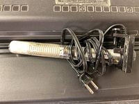 Submersible aquarium heater with power cord shown wrapped around the heater element.