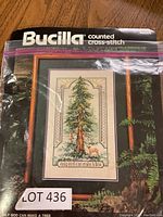 Bucilla counted cross stitch pattern in original packaging showing the completed design on the front with tree and deer