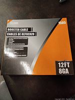 Box front showing brand, cable type, 12ft length, and 8 gauge wire specification.