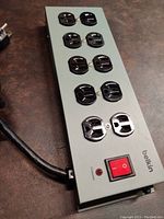 Full view of Belkin surge protector power strip showing 10 outlets and power switch.