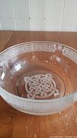 Crystal bowl showing Celtic knot design inside the base and partially visible rim design.