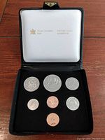 Full shot of the 1980 Canadian coin set in original Royal Canadian Mint case showing all seven coins.