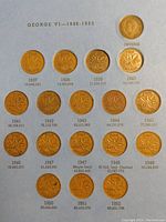Blue album page showing 18 Canadian one cent coins from 1937 to 1952, featuring King George VI, including a 1947 Maple Leaf variety and a 1948 limited edition coin, with mintages listed below each coin.