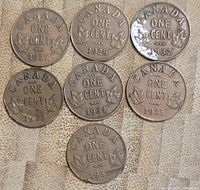 Eight Canadian one cent coins arranged in two rows, showing dates and maple leaf design on the reverse side.
