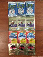 Top down view of all 12 unopened packs arranged in rows, showing front packaging of 3 Fleer Ultra, 3 O-Pee-Chee Premier, 3 1988 Topps, 3 Donruss MVP packs