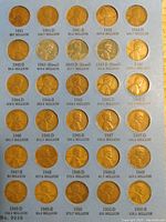 Photo showing 30 one cent coins from 1941 to 1950 arranged in holder with mintage numbers and mint marks visible