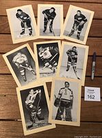 All eight vintage Beehive hockey photos laid out showing different players from Detroit Red Wings, Montreal Canadiens, and Boston Bruins.