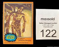 Close-up photo of a Star Wars trading card showing C-3PO with blue and orange border, numbered 141, with a Maxsold printed card number 122.