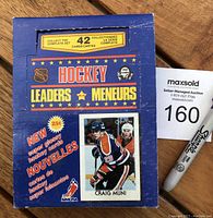 Front cardboard box with NHL and NHLPA logos and hockey player image, stating 42 card subset and super glossy cards.