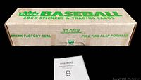 Rectangular white cardboard box with green Fleer logo and labeling, unopened and sealed, displaying box top with instructions to break factory seal and pull flap to open.