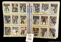 Binder pages with Pittsburgh Penguins player cards including Mark Recchi, Wendell Young, Troy Loney, Randy Gilhen, Bob Errey, John Cullen, Kevin Stevens, Jamie Leach, Randy Hillier, Mario Lemieux, Tony Tanti, Barry Pederson, Gord Dineen, Gilbert Delorme, Alan Chevrier, Paul Coffey, Jim Johnson, and Dale Yelanski.