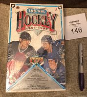 Front view of sealed 1991-92 Upper Deck High Series hockey card box with original shrink wrap and NHL player artwork.