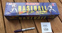 Full front view of the sealed Fleer '91 baseball card box showing box branding, factory seal, and included card and sticker count.