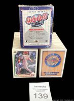 Front view of 1991 Upper Deck Baseball Final Edition Set box with accompanying stacks of cards numbered 1-800 and checklist card visible.