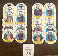 Photo of 24 round Hostess discs arranged in two columns featuring players from Toronto Blue Jays and Montreal Expos