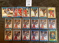 Top view of 20 hockey rookie cards laid out in four rows.
