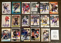Photo showing a layout of the first 18 autographed NHL cards arranged in three rows, with signatures visible on each card from players like Patrice Bergeron, Kirk Muller, Rod Brind'Amour, Zdeno Chara, Daniel Briere, Emile Bouchard, Tie Domi, and others.