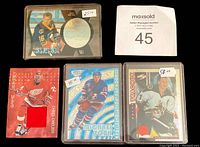 Lot of hockey insert, parallel, and subset cards from 1992-2012, showing some individual cards with player imagery, some jersey insert cards and holographic foil elements.