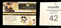 Close up of Sidney Crosby hockey card numbered insert showing stats and player image