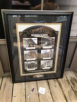 Front view of black framed collage titled 'End of an Era: The Original Six Arenas', showing six photographs