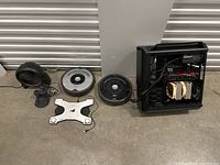 Wide view of all items: desk fan, two Roombas, laptop cooler, PC tower