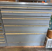 Front view of full cabinet showing drawer layout and overall condition