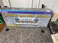 Boxed Yamaha EZ-30 keyboard with brand and model visible