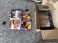 Box of Nintendo Power magazines with a selection of official guides laid out