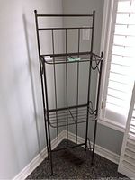 Front angled view of the metal shelving unit showing structure, shelves, and foldable design
