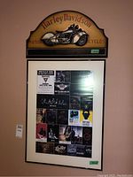Harley Davidson three-dimensional motorcycle relief and a framed Harley Davidson print featuring vintage motorcycle advertisements and images.
