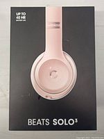 Box front showing Beats Solo 3 branding and headphone image in pink color with wireless and battery life information