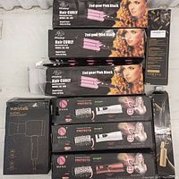 Three Woalscy Hair Curly hair curler boxes stacked showing product branding and usage picture.