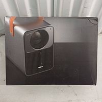 Box with printed image of Jireno Cube 4 projector on side showing overall product packaging.
